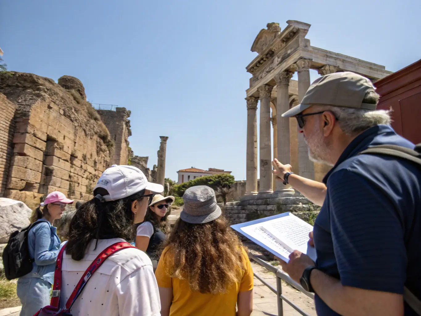 A photograph of ASSOCIATION SAINT SULPICE members conducting a guided tour of a local historical site, emphasizing the educational aspect of their preservation efforts.